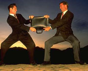 Two men fighting over a brief case